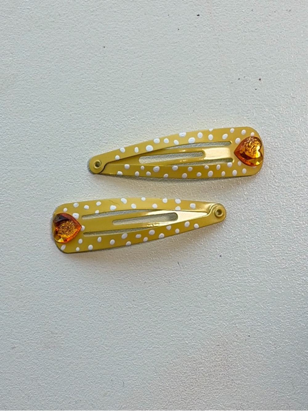 Yellow and white polka dot heart hair clips